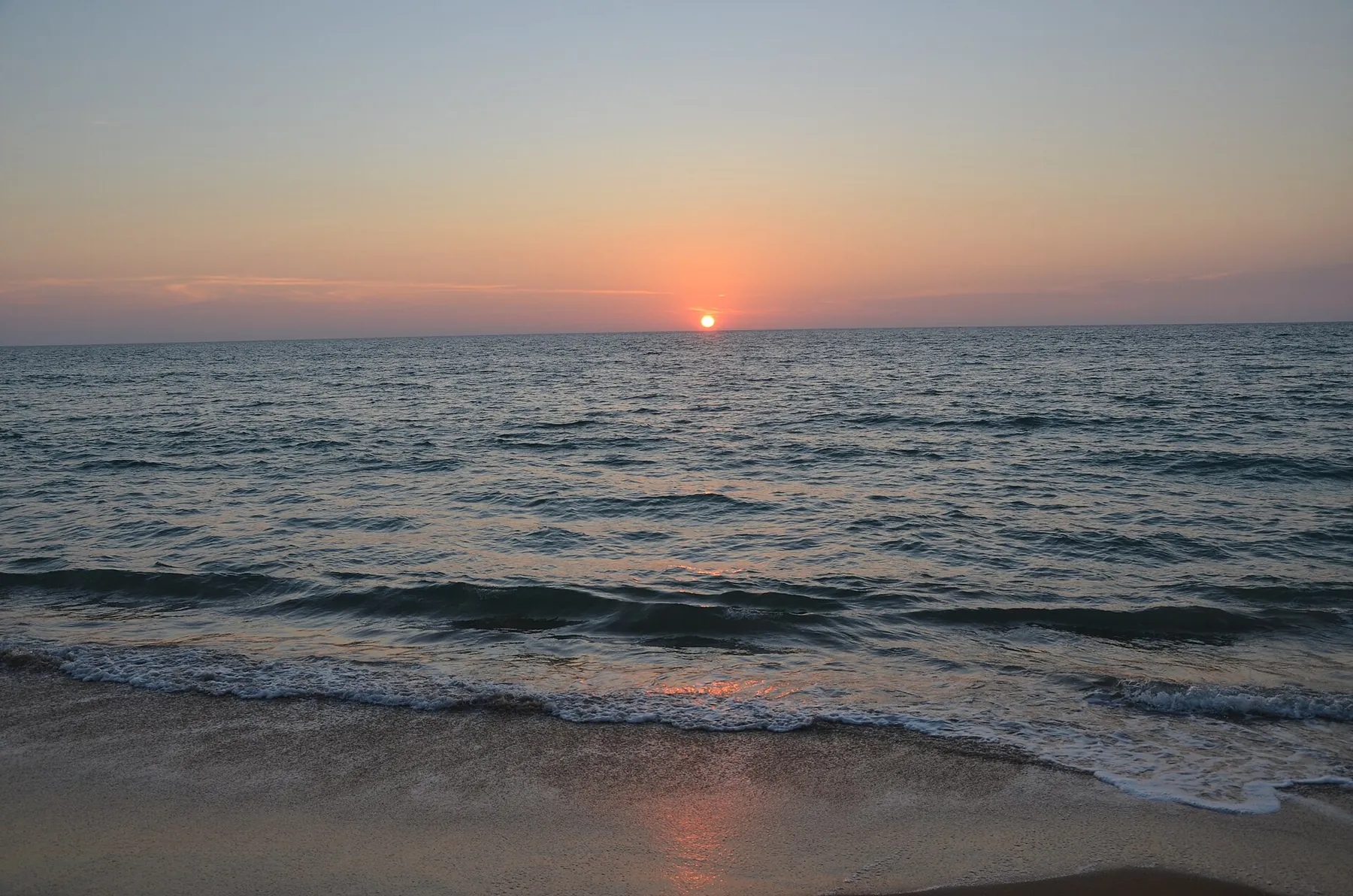 The sun setting over the sea off Kalpitiya beach.