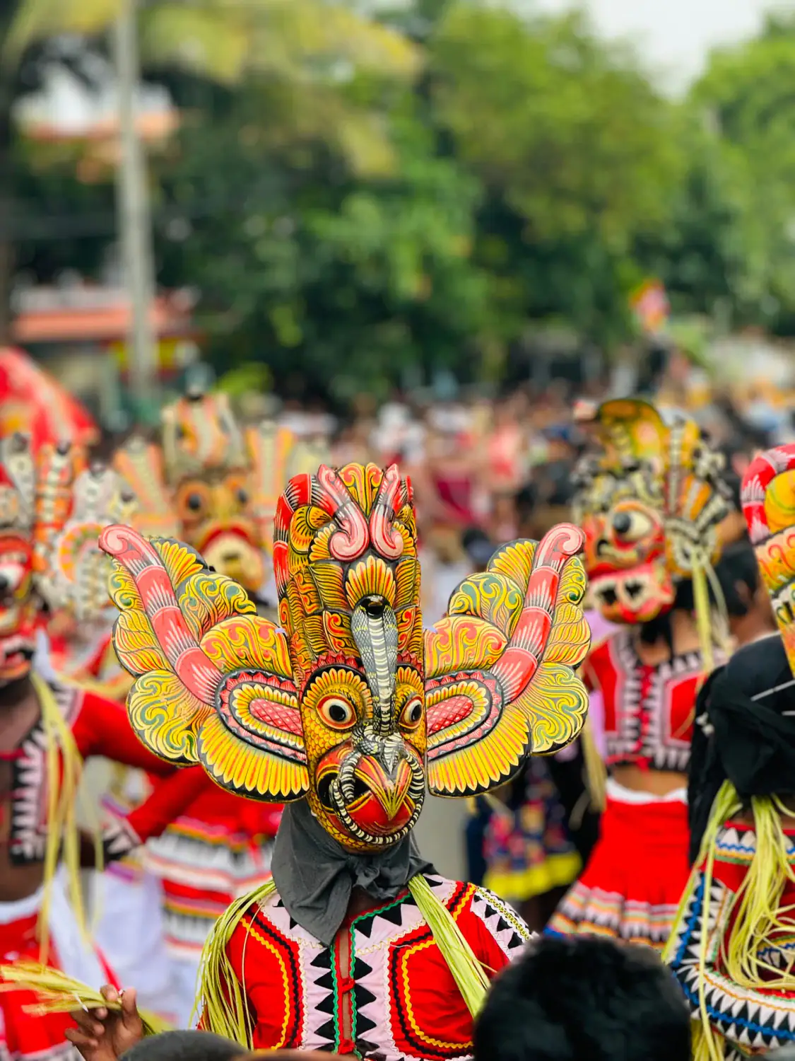 Colourful traditional masked dancers in the streets of Matara.