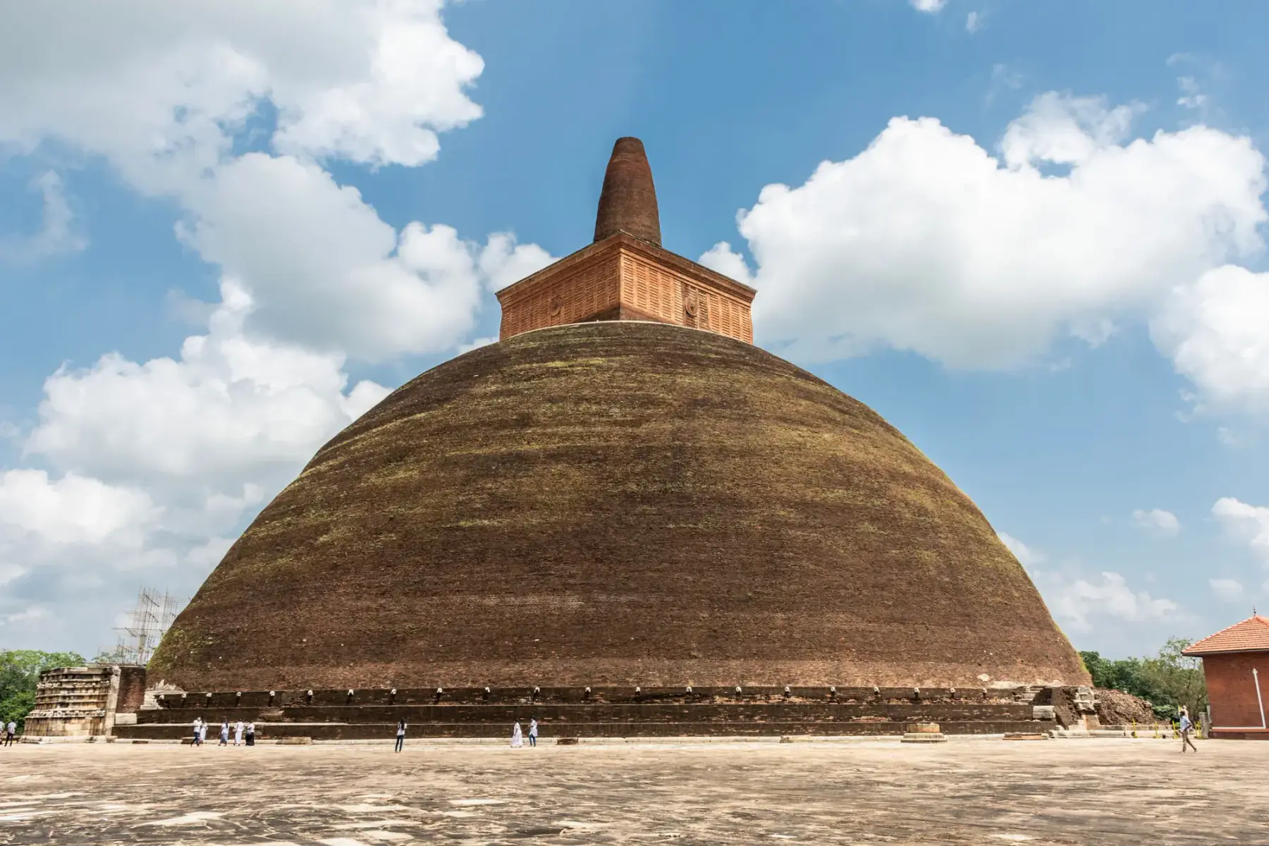 The Abhayagiri stupa under a blue sky in Anuradhapura.
